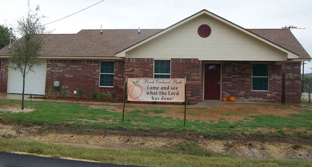 outside of first completed house for project