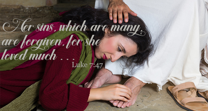 a woman worshiping at the feet of jesus